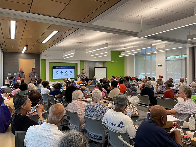 Police Crime Prevention Officer Sean Corcoran speaks to a packed house at the Mount Vernon Senior Safety Summit last week.