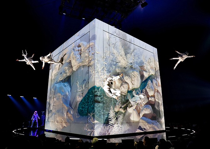 Central to the story, the 23 sq.ft - 2 ton, CUBE commands the stage, packed with lights and projection equipment