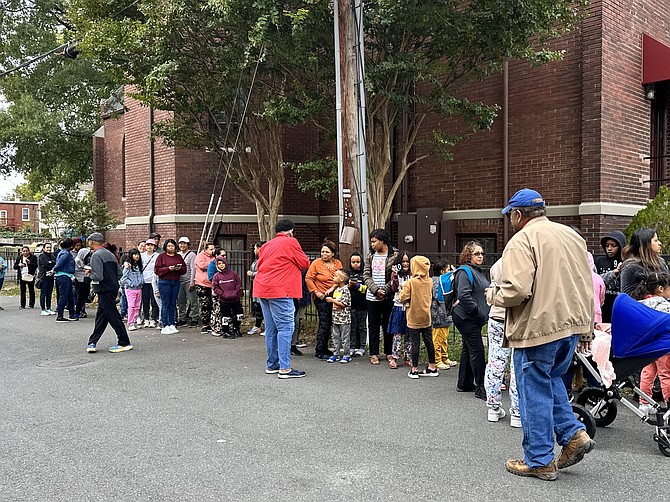 Families line up for the start of the CCNA winter coat distribution and community resource day Oct. 9 at St, Joseph’s Catholic Church.