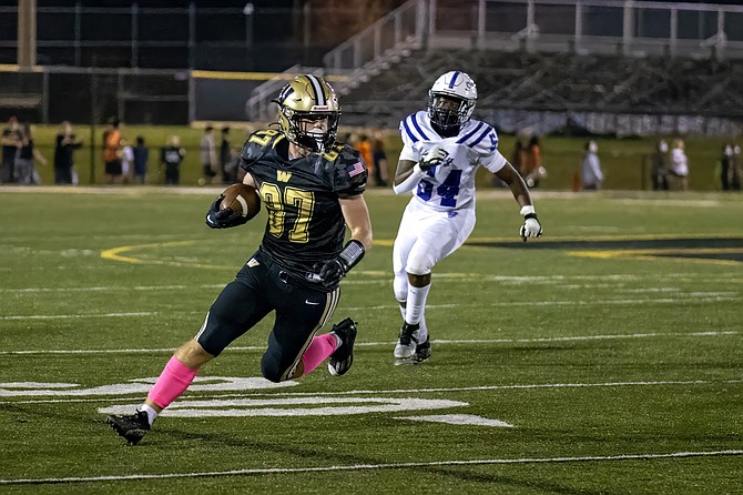 Everrett Sawyer runs with ball after reception