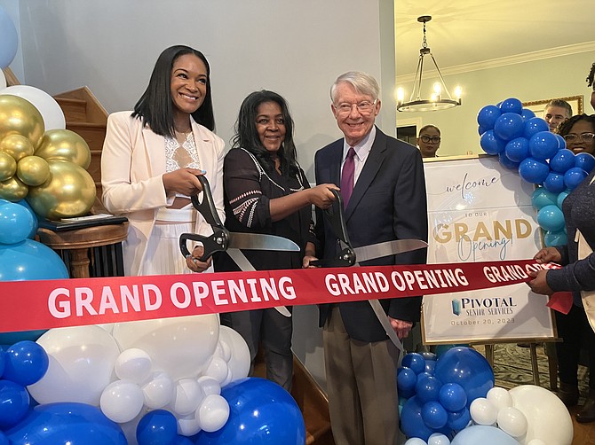 Shauna Toussaint and her mother cut the ribbon to open the new Pivotal Memory Care and Residential Assisted Living Home on Hibbling Avenue in Springfield.