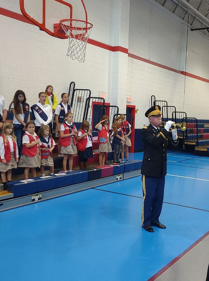 Lt. Col. Steve Tracy sounds TAPS during the Veterans Day Ceremony Nov. 11 at Mount Vernon Recreation Center.