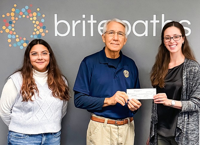 American Legion Post 177 in Fairfax City is sponsoring Britepaths’ Holiday Program for a third year. And on Oct. 18, Mike Kimlick, Post 177’s Finance Officer, presented Britepaths’ staff with a check for $2,500. From left are Britepaths Programs Manager Brenda Hernandez, Kimlick, and Britepaths Community Development Manager Harper Garcia.