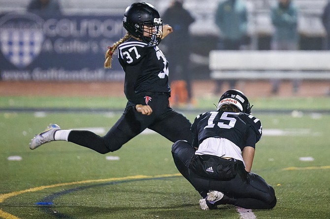 Madison HS place kicker Danika Pfleghardt #37 successfully kicks an extra point after a Madison touchdown