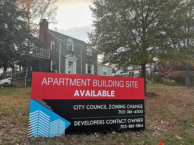 A house on Janneys Lane advertises an apartment building site to call attention to the potential controversial change to single family zoning regulations.