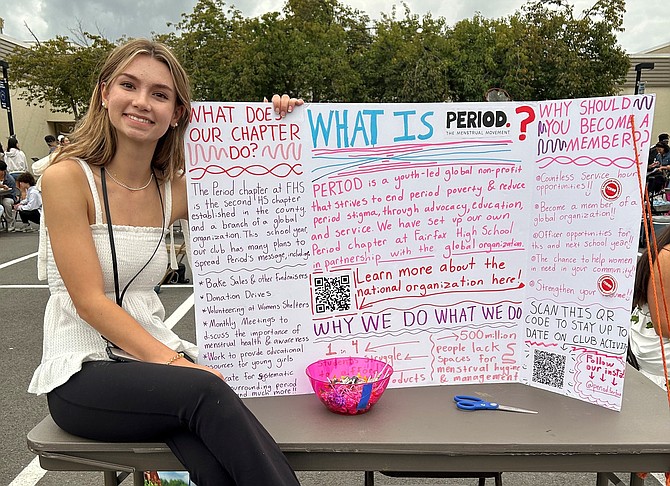 Maisie Curtin promoting the PERIOD Club at a school event.