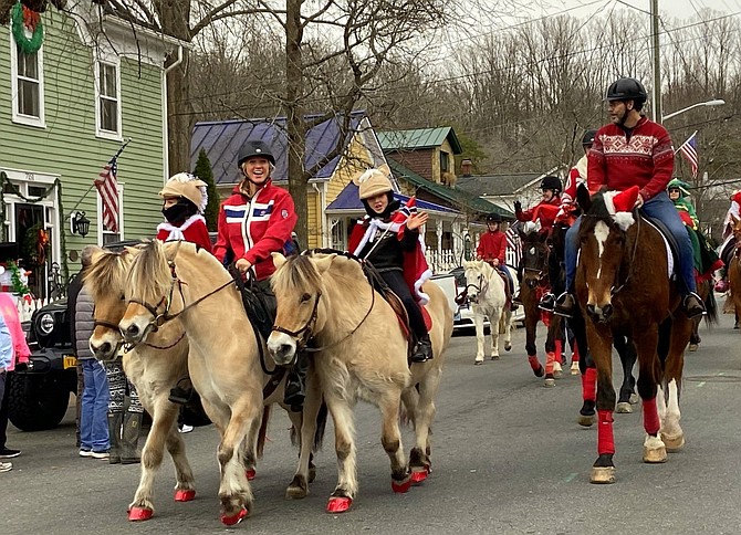 Horses make their way through town during a past Clifton Horse Parade.