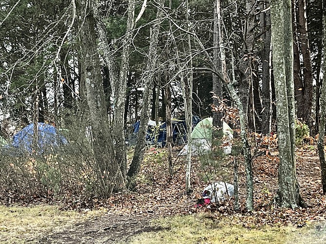 A tent city on Saturday, Dec. 4, 2023 sees dozens of additional tents erected on the hill to shelter residents who are experiencing homelessness in North Fairfax County.