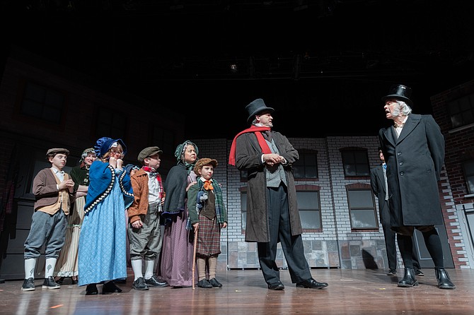 Graham Arnold, Miranda Lacy, Katy Ellis, William Carden as the Cratchit children, with Missy Ledesma-Leese as Mrs. Cratchit, Nina Hall as Tiny Tim, James Senavitis as Mr. Cratchit and Bob Chaves as Scrooge in the LTA production of A Christmas Carol playing now through Dec. 16.