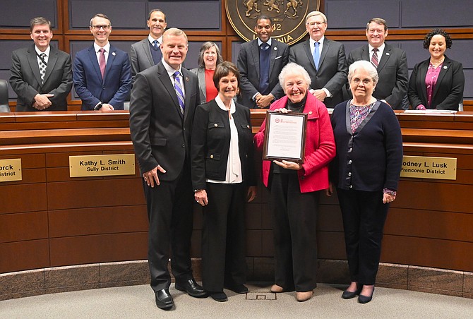 Penny Gross, Mason District Supervisor, holds the board-approved resolution recognizing her for honorable service. She is retiring on December 31, 2023.