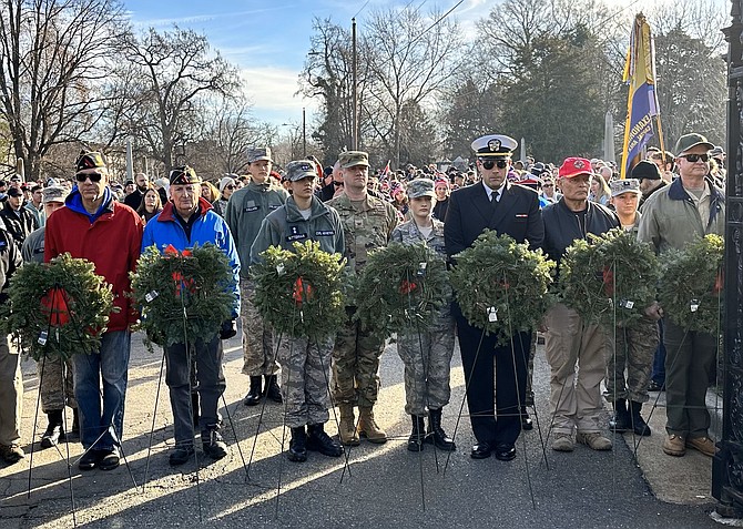 Representatives of various military organizations prepare to place honorary service wreaths as part of Wreaths Across America Dec. 16 at Alexandria National Cemetery.