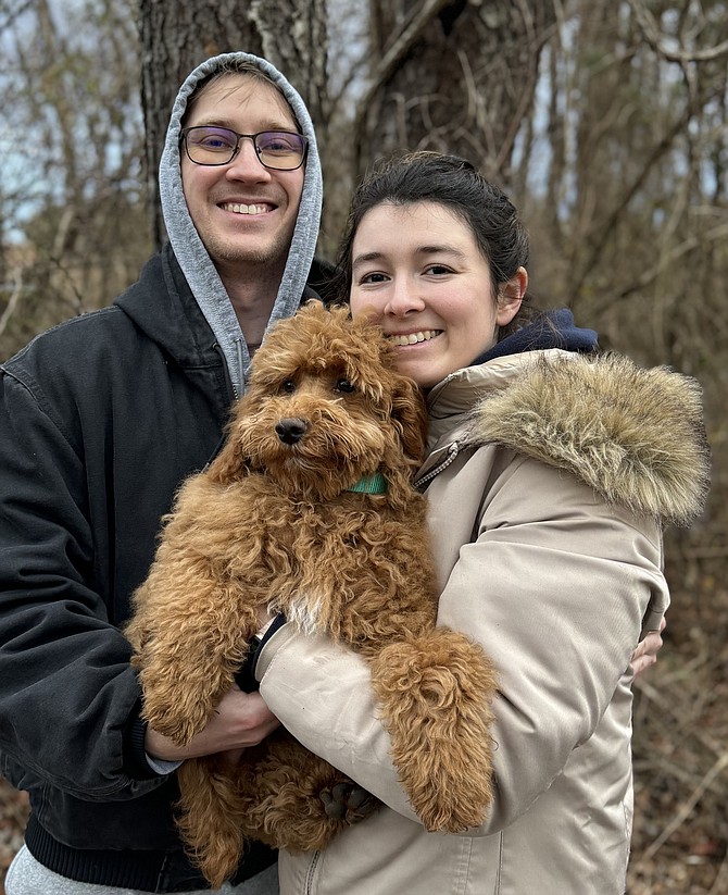 First Day hikers Connor Hubbard and Christian Falcon of Lorton, celebrate the day, taking  new puppy Uno, 4 months, on his first walk, opting for a self guided hike at Laurel Hill Park2