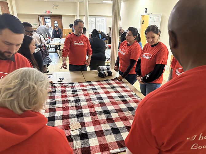 Shiloh Baptist Church leaders instruct volunteers who have gathered to make prayer blankets for the community Jan. 15 as part of the Martin Luther King Jr. Day of Service.