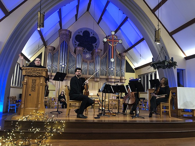 The Ninth Street String Quartet opened the concert at Saint George’s with an introduction by Jennifer Wade, violinist with the quartet and Lifescape coach, who brought the idea of a calming, sacred, reflective concert combining poetry, light, art, and music to the pre-Christmas concert.
