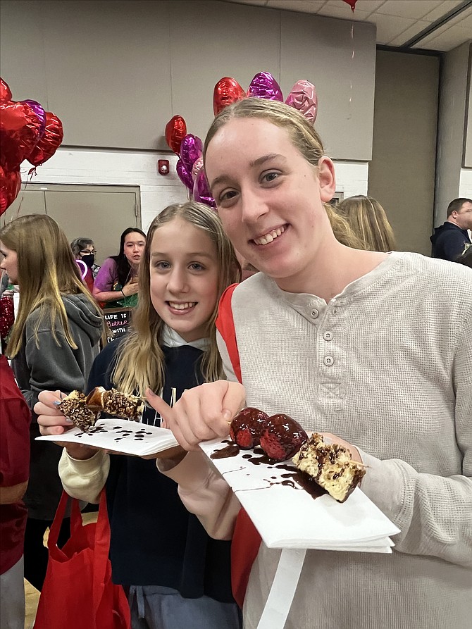 Nellie Bartkowski, 11, and Nora Bartkowski, 13, of McLean, can’t say no to the fruit and cake kabobs for lunch. The melted chocolate takes them to another level, making the treat irresistible.