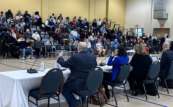 Members of City Council answer questions on the proposed Potomac Yard Entertainment District during a public town hall meeting Jan. 27 at Charles Houston Recreation Center.
