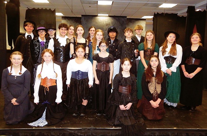 The cast of “Sweeney Todd,” school edition, poses in character.