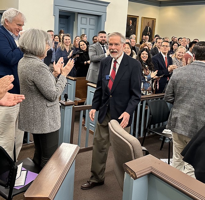 The Hon. James C. Clark receives a standing ovation as he is introduced during his retirement ceremony Feb. 1 at the Franklin P. Backus Courthouse.