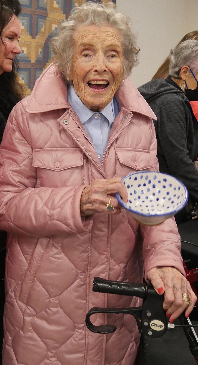 One-hundred-and-two-year-old Betty Ochenrider chooses a colorful pottery bowl for her soup. “I like it because it’s different. It’s happy.”