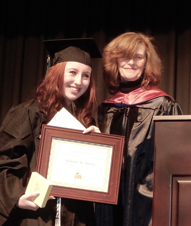 Anabelle McAllister receives the Faculty Award from Leslie Chekin.