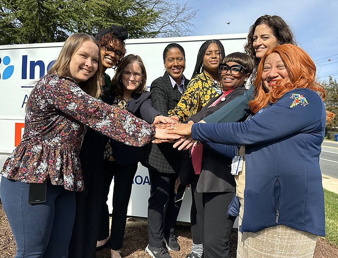 Social workers from Inova Alexandria Hospital gather for a photo March 12 to celebrate Social workers Awareness Month. Pictured are: Tara Quinn, Asia Pleasants, Courtney Brown, Shawne Golson, Colbie Lewis, Michelle Olewa Thornhill, Jensena Petersen and Anner Terry-Mock.