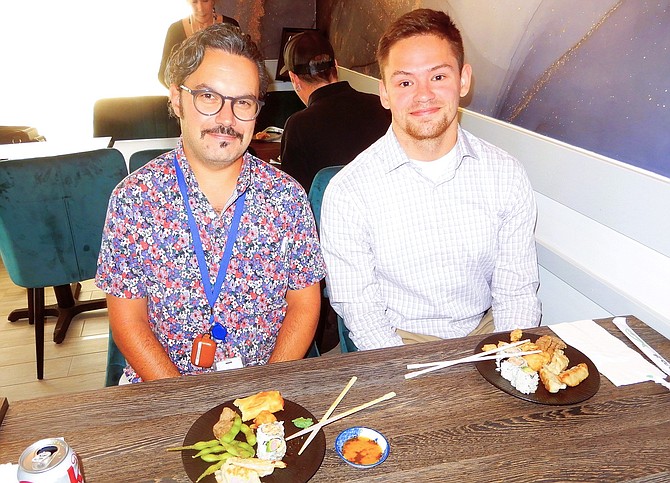 From left, Matt Easley and Joey Peppersack enjoying sushi, dumplings, edamame and spring rolls.