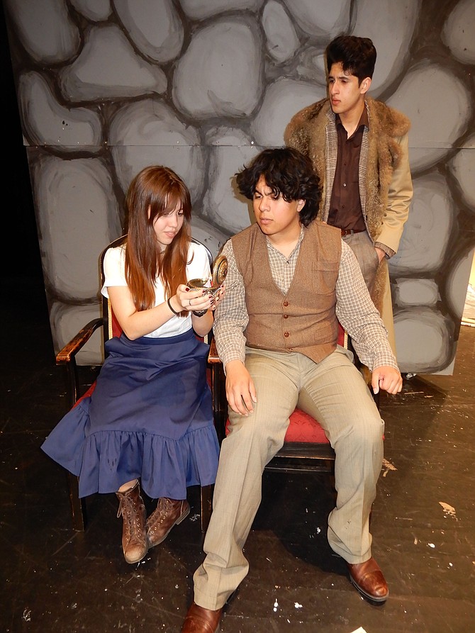 From left, Kaylee Williams, Alejandro Cahoon and Tristan Farmer in a scene after Dmitry gave Anya the music box.