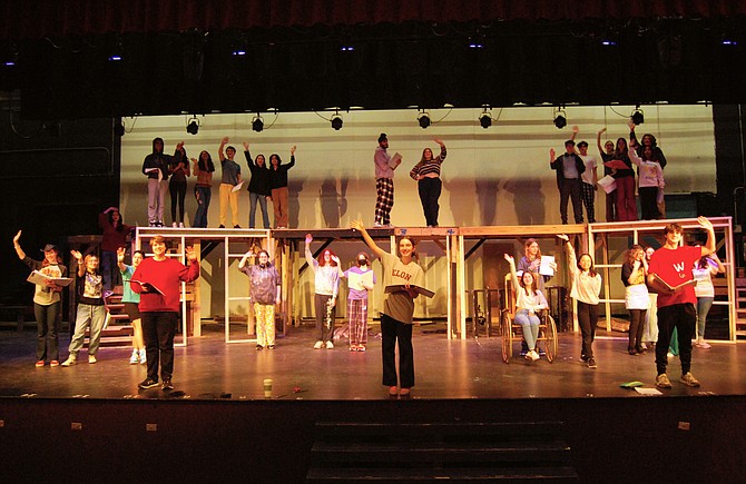 The cast waves goodbye during a rehearsal of the song, “Bon Voyage.”