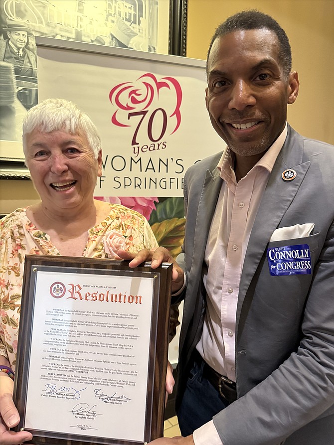 Springfield Woman’s Club President Shirley Coling accepts Fairfax County Resolution from Franconia District Supervisor Rodney Lusk as Club marks its 70th anniversary