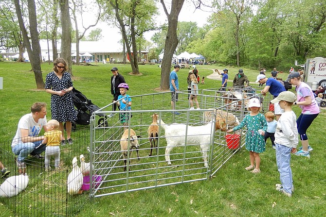 Parents and children enjoying the petting zoo at last year’s HisTree Day. This year’s day is Saturday, April 27.