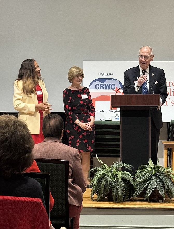 Gant Redmon, right, makes remarks after accepting a donation on behalf of the Symphony Orchestra League of Alexandria in memory of his wife Fran, a longtime SOLA supporter and board member. The donation was made by Shirley Miles and Laurie Kirbey, left, on behalf of the Commonwealth Republican Women’s Club April 25 at The Lyceum.