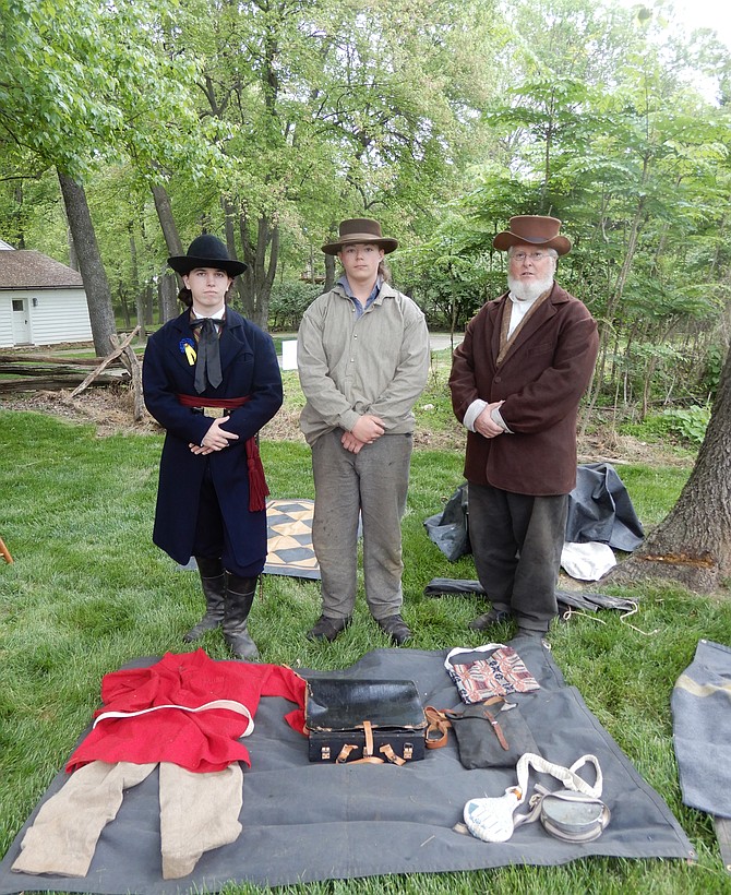 From left, James McVicker, Nick Bright and Jim McVicker (James’s dad) portray recruiters for the 8th Virginia Infantry, Company G, at the start of the Civil War.