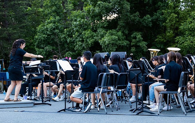 Band Director Melissa Hall conducts the young musicians outdoors.
Photo Courtesy of Melissa Hall