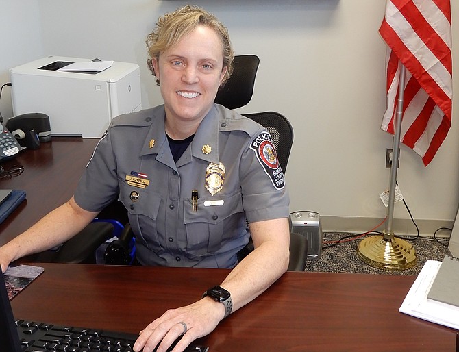 Major Jane Russell at her desk in the Sully District Police Station.