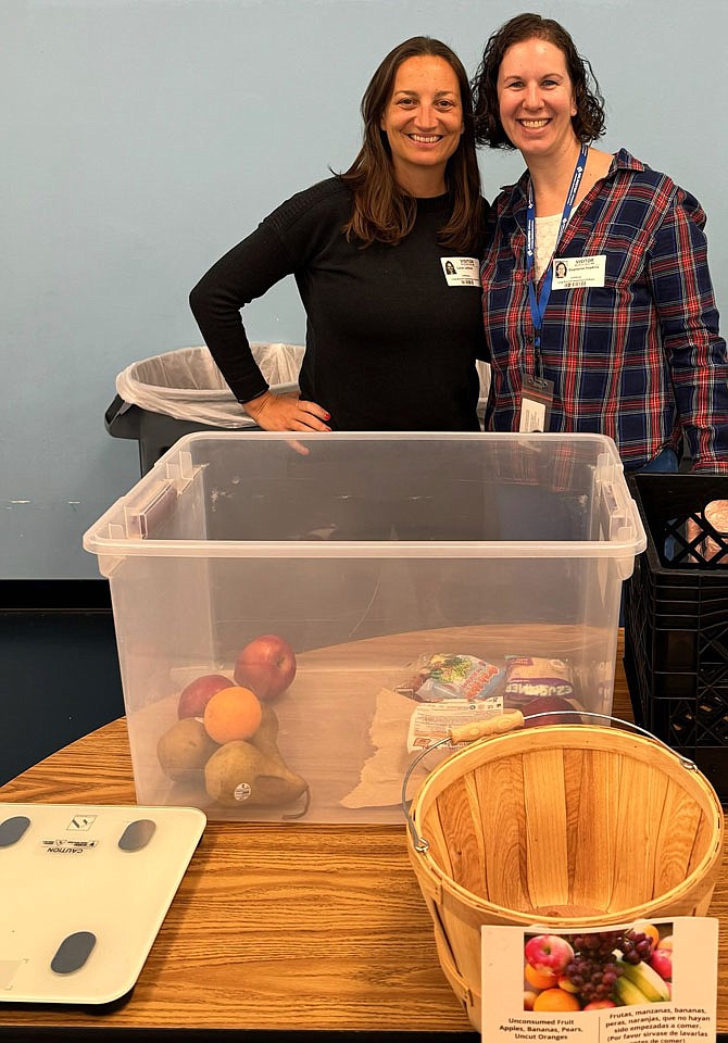 Stephanie Hopkins (right), Arlington County Department of Human Services Food Security Coordinator and a co-worker Lucie Leblois visit Long Branch Elementary Food Share program.