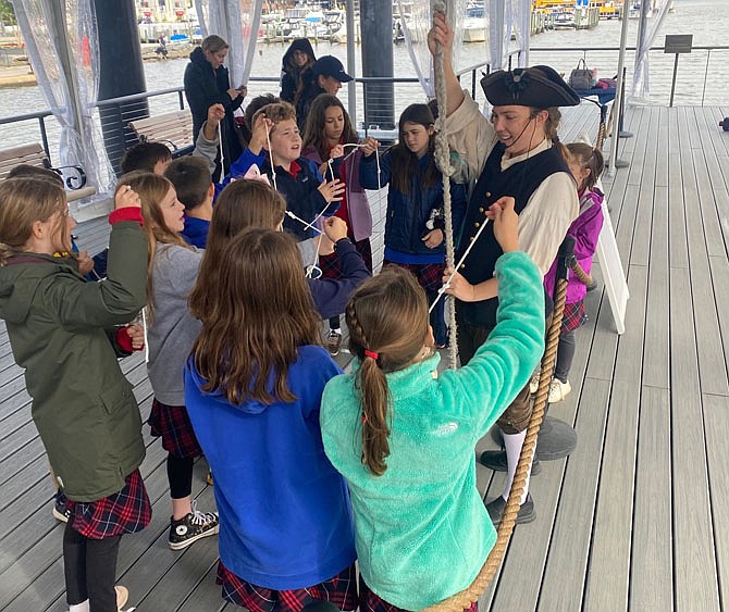 Students participate in knot relay activity aboard the Tall Ship Providence moored at the Alexandria waterfront.