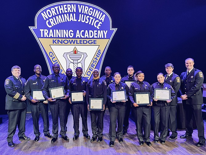 Sheriff Sean Casey, left, with Deputy Ismael Yacouba Garba, Deputy Emeka Eze, Deputy Malik McCoy, Deputy Solomon Wodajo, Deputy Yassoukaye Reynolds, Deputy Kevon Adams, Deputy Sarah Born, Deputy Elliangel Vega, Deputy Portia Green, Deputy Ashley Chavez, Undersheriff Robyn Nichols, and academy instructor Master Deputy William Summers at the June 17 graduation from the Northern Virginia Criminal Justice Training Academy.