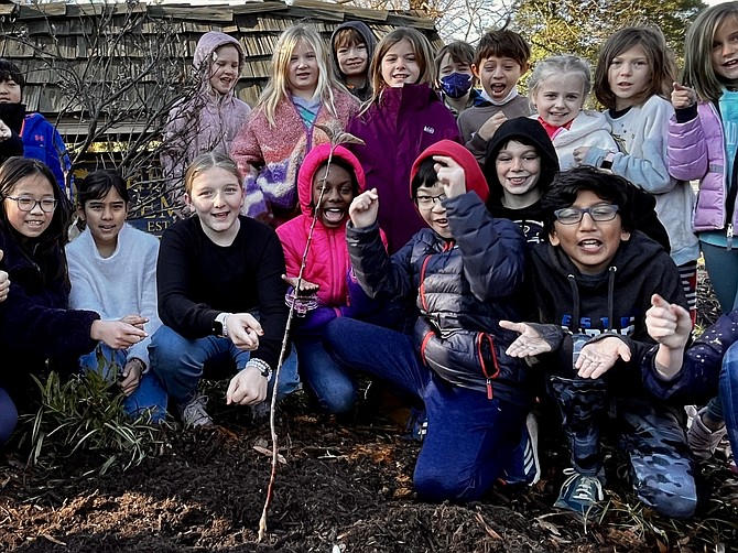 Children at Great Falls Elementary School, a Fairfax County Public School, participate in a tree planting program on Jan. 13, 2023.