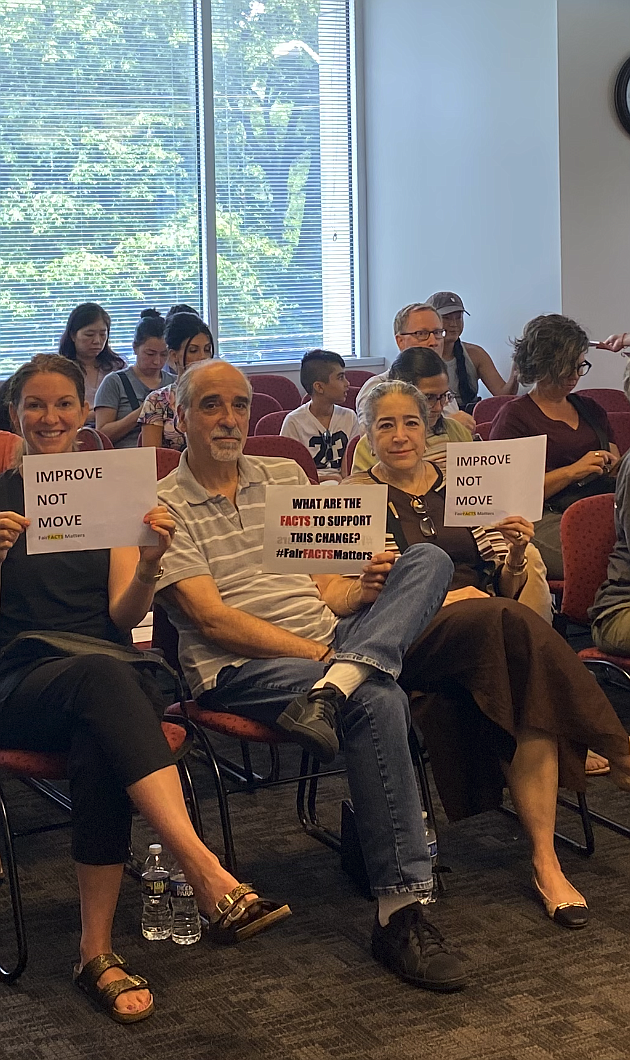 Attendees at last week's Fairfax County School Board work session, which discussed the Governance Committee's draft policy, protested in silence by carrying signs that said, "What are the facts to support this change?" and "#FairfactsMatters."