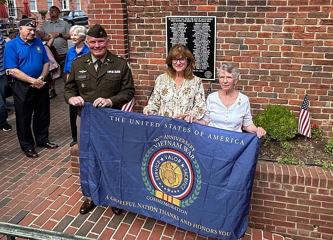 Col. Patrick Cramer, left, is joined by Gold Star family members Joan Mashburn and Sue Rampey at the plaque dedication ceremony June 14 at Gadsby’s Tavern.