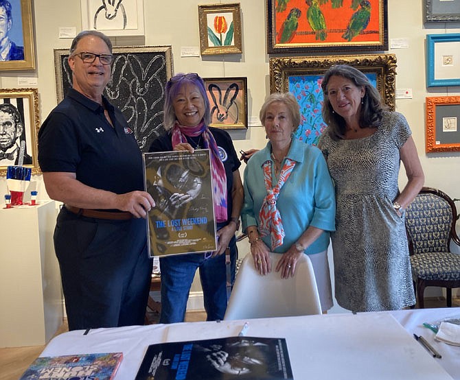 Photographer May Pang, second from left, with Rotary Club president Jim Carmalt, and Rotarians Debbie Sheridan and Robin Arnold at a reception July 19 at Nepenthe Gallery. The gallery hosted local Rotarians as part of a special exhibit featuring Pang’s photographs of John Lennon.