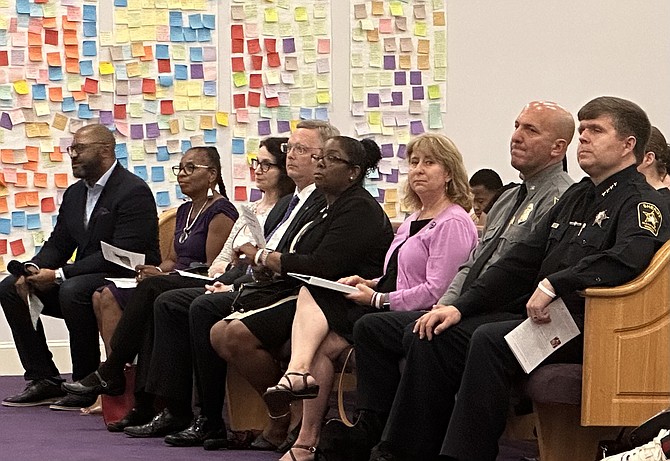 Shiloh Baptist Church’s Reverend Dr. Taft Quincey Heatley (far left) sits with city officials at the remembrance memorial for Benjamin Thomas, victim of a lynching in Alexandria on Aug. 8, 1899.