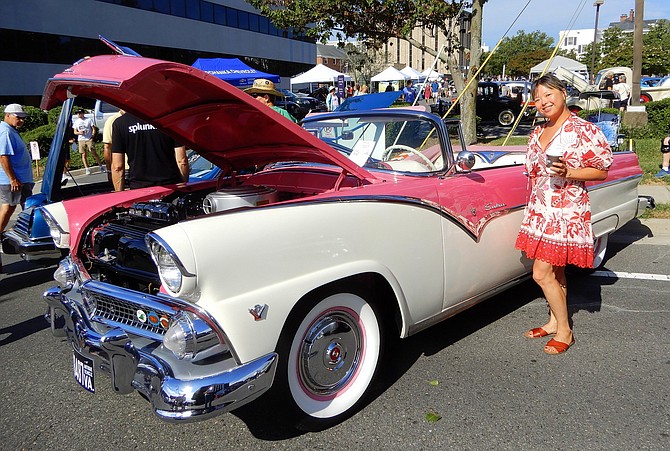 Yaya Hsu poses by a 1959, pink-and-white, Ford Sunliner convertible at last year’s event.