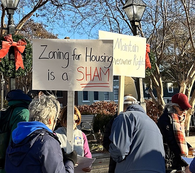 Protesters hold signs in opposition to the proposed changes in zoning Nov. 25, 2023 at Market Square. City Council unanimously passed the changes Nov. 28, 2023. On Aug. 26, a judge ruled that a lawsuit filed by citizens against the city can proceed to trial.