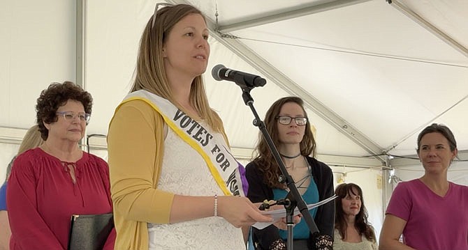 Katie Crooks, Director of Museum and Visitor Experience, reads a portion of President Biden’s proclamation honoring Women’s Equality Day