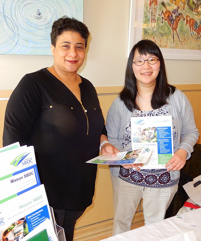 Promoting the George Mason Small Business Development Center at the last luncheon are (from left) Sara Linus and Aung Shepelev.