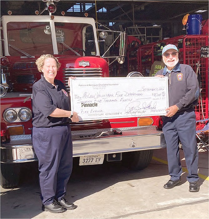 Patricia Moynihan, MVFD President, and Bob Freda.