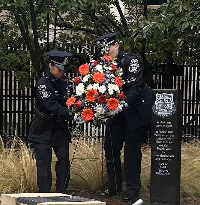 APD honor guard members place a wreath at the memorial to law enforcement officers who have died by suicide during a Sept. 25 ceremony commemorating National Law Enforcement Suicide Awareness Day.