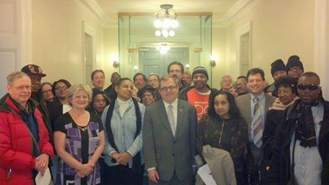 State Sen. Adam Ebbin, center, stands with the VIC delegation at the General Assembly.