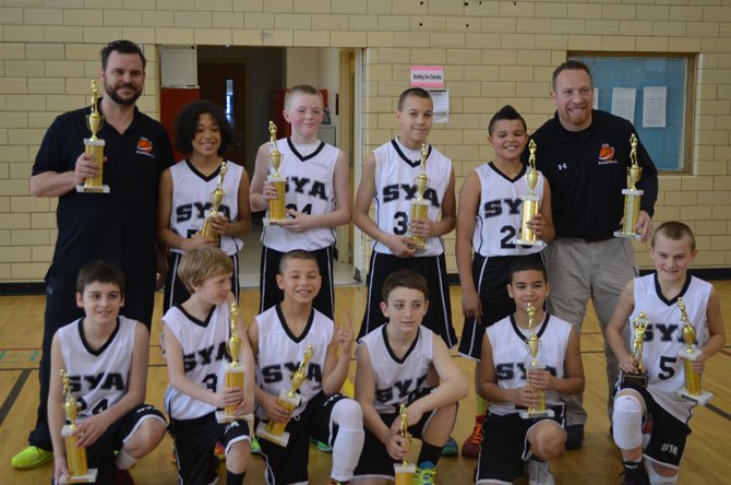 The championship SYA 5th grade Boys Grade D1 Basketball Team: Chris Kuzemka, Ty Wilson, Ryan Gertenbach, Jacob Thomas, Avery Ford, LT Nesby-Thomas, Jonny Heslep, Cameron Farrell, Isaiah Rodriguez and Michael O’shea with Coach Jon Heslep and Assistant Coach Dave Thomas.

